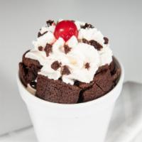 Brownie Sundae · Warm brownie topped with 3 scoops your choice of ice cream, hot fudge, whipped cream and a c...