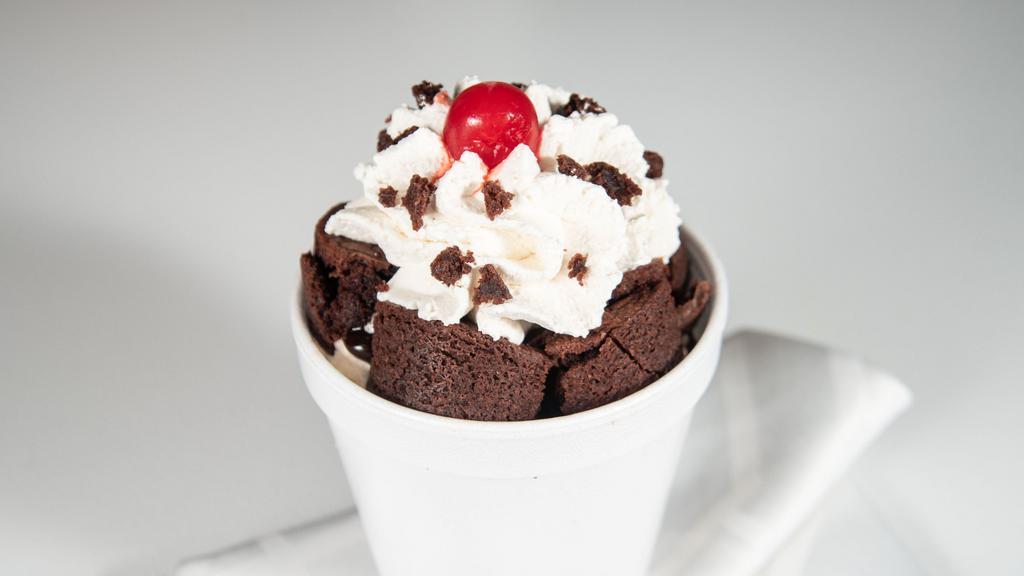Brownie Sundae · Warm brownie topped with 3 scoops your choice of ice cream, hot fudge, whipped cream and a cherry.