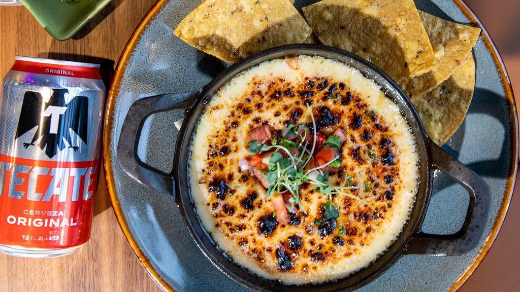 Hot Queso Dip · House blend queso, jalapeño, smoked paprika.