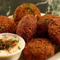 Falafel ( Vegetarian ) · An Arabic classic; chickpeas, beans, garlic, parsley and tahini mixed together into a ball, ...