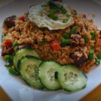 House Fried Rice · Fried rice with onions, carrots, scallions, egg and green peas.