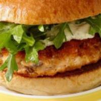Salmon Burger  · Juicy salmon burger served with lettuce sweet peppers hot peppers and tomatoes topped with m...