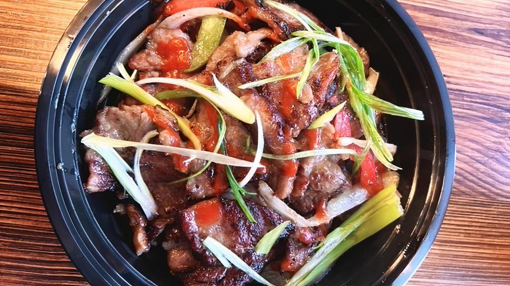 Beef Bulgogi · A dish of thinly sliced grilled steak. that has been marinated in house special sauce. with onion red/ green pepper and scallions, mild or spicy.