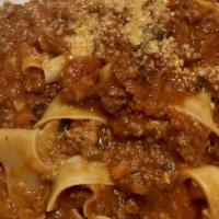 Pappardelle Bolognese · Classic bolognese; meat and pork with tomato ragu.