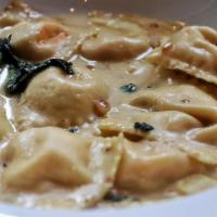 Lobster Ravioli · Filled with fresh lobster meat, served in a mascarpone, lobster velouté and garnished with s...