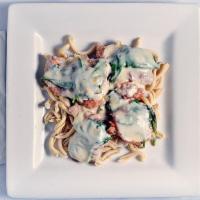 Veal Saltinbocca · Tender medallions topped with sage, prosciutto, spinach and mozzarella, served over casarecc...