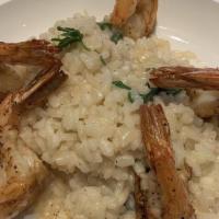 Shrimp Risotto · Jumbo shrimp in a seafood reduction broth over spinach risotto.