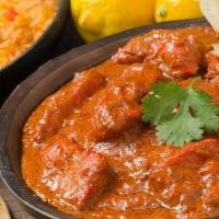 Chicken Tikka Masala · chicken boneless cooked with cream and chef special recipe . served with white rice
