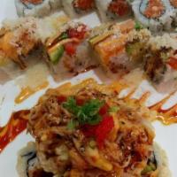 Manhattan Roll · Raw/under cooked advisory. Shrimp tempura, cucumber inside with lobster salad, spicy tuna, a...