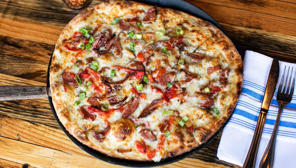 Beer Cheese · Beer cheese sauce and cheese blend, topped with reindeer sausage, roasted red peppers, and bacon, finished with fresh green onions.