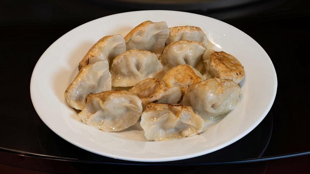 Ap/E. Pan Fried Dumpling 煎饺 · Soft on the top and crispy on the bottom, these juicy, tender dumplings are sure to delight! 12 pieces.