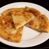 Ap/K. Scallion Pancake 葱油饼 · Savory Chinese flatbread folded with oil and minced scallions, with crispy, pan-fried edges ...
