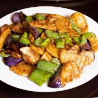 Stir Fried Potatoes, Green Pepper And Eggplant 地三鲜 · Slices of potatoes, green pepper, and eggplant tossed and mixed before being stir-fried toge...