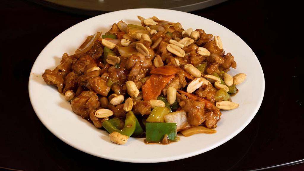 Kung Pao Chicken 宫保鸡 · Hot and spicy stir-fried chicken sprinkled with an assortment of vegetables and peanuts.