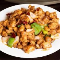 Lazi Chicken 辣子鸡丁 · Stir-fried chicken dices mixed in chili sauce to create a juicy, spicy sensation.