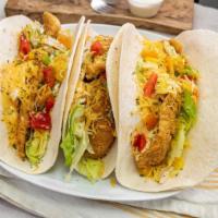 Fish Taco · 3 pieces fish (Whiting) wrapped in tortilla with peppers, parsley, Chipotle sauce and  shred...