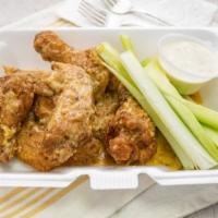 Flavored Wings · 6-8 Wings Deep Fried and Hand tossed in
our Signature Sauce of choice & Bread