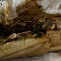 Vegan Beef Cheese Steak · Served with fried onion and green peppers.