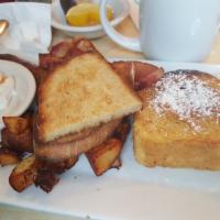 The Rox Combo · Two eggs any style, sausage and bacon, brioche french toast, toast and home fries.