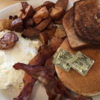 The Big Rig Combo · Two eggs any style, sausage and bacon, two pancakes, toast and home fries.