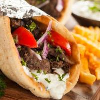 Gyro Sandwich · A blend of lamb & beef strips topped with Tzatziki sauce, lettuce, tomatoes & onions in Pita...