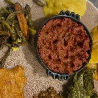 Veggie Combo - 7 Items · Spicy lentils, yellow peas, collard greens and cabbage.