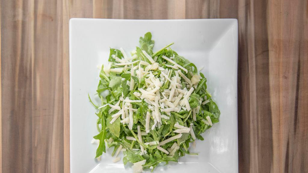 Arugula Salad · Arugula with sharp pecorino romano cheese and lemon-extra virgin olive oil dressing.