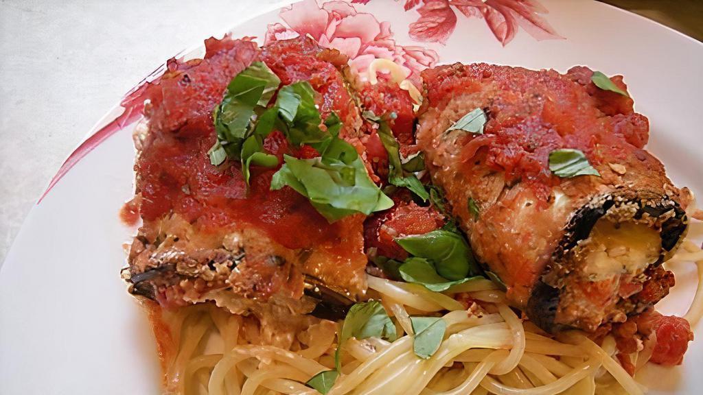 Eggplant Rollatini(With Spagheti) · Egg battered fresh eggplant rolled with ricotta cheese, baked with tomatoes sauce and mozzarella cheese