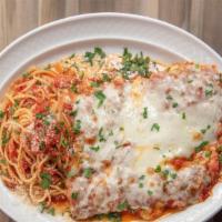 Pollo Alla Parmigiana · Lightly breaded chicken, cutlet baked with fresh marinara sauce and mozzarella cheese (spagh...