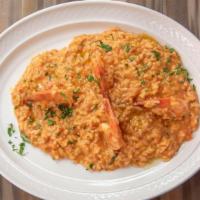 Risotto Agli Scampi · Arborio rice sautéed with extra virgin olive oil w/ garlic and shrimp, in a pink cognac sauce.