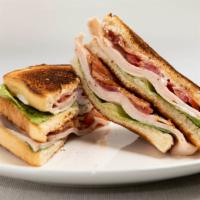 Turkey Club Sandwich · Mayo, lettuce, tomatoes, and bacon.