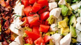 Cobb Salad · Tossed salad with marinated grilled chicken, bacon, hard boiled eggs, feta cheese and crouto...