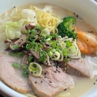 Tonkotsu Ramen · Includes pork chashu, cabbage, wakame, scallions, sesame seeds, red ginger, egg