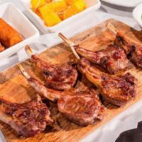 Lamb Chops (10 Oz) · Served with your choice of 3 sides (brown rice with veggies, white rice, creamy mashed potat...