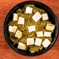 Palak Paneer · Paneer cooked in creamed spinach.