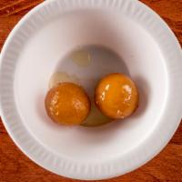 Gulab Jamun · 2 Pieces. Indian sponge cake served with sugar syrup.