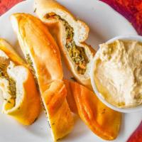 Spinach Pie · Cooked spinach with olive oil, lemon juice & Arabic spices.