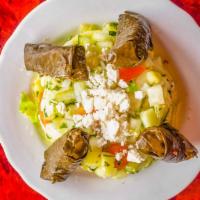 Side Of Grape Leaves · 4 pieces of grape leaves over 12 oz of cucumber salad & it comes w/ a side of pita bread.