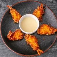 Coconut Shrimp Appetizer · Jumbo shrimp rolled in a combination of coconut flakes, spices and breadcrumbs for baking, s...