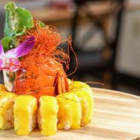 Boston Lobster Roll · Whole Boston lobster, lobster salad, and mango wrapped in soy paper with fresh mango sauce.