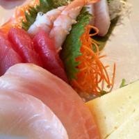 Sashimi Combo · Tuna, yellowtail, salmon, tilapia, shrimp, tamago and a little seaweed salad.
