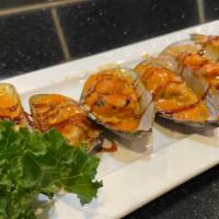 Baked Green Mussels · Little spicy. Freshly baked mussels with masago sauce.