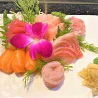 Sashimi Deluxe · 18 pieces assorted raw fish.