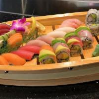 Party Boat For 2 · 10 pieces sushi, 15 pieces sashimi, California roll and a chef special roll.