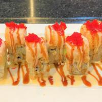 Ocean Roll (8 Pieces) · Inside: salmon tempura, avocado, and cream cheese. Top: lobster salad, eel sauce, seafood sa...