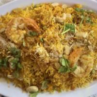 Shrimp Biryani · Tender shrimp cooked with basmati rice and traditional spices & herbs.