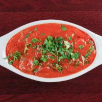 Chicken Tikka Masala · Breast meat chicken skewed in tandoor ( clay oven) and sautéed in a rich creamy sauce topped...