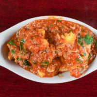 Chicken Vindaloo · Boneless chicken cooked with potatoes in a spiced and vinaigrette sauce.