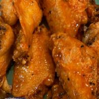 Buffalo Wings · 5 fresh & meaty bone in wings coated with buffalo wing sauce and served with blue cheese dip...