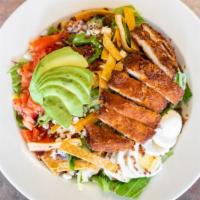 Cobb Salad · Breaded chicken, hard boiled egg, onion, bacon, tomatoes, avocado, corn chips, feta cheese a...